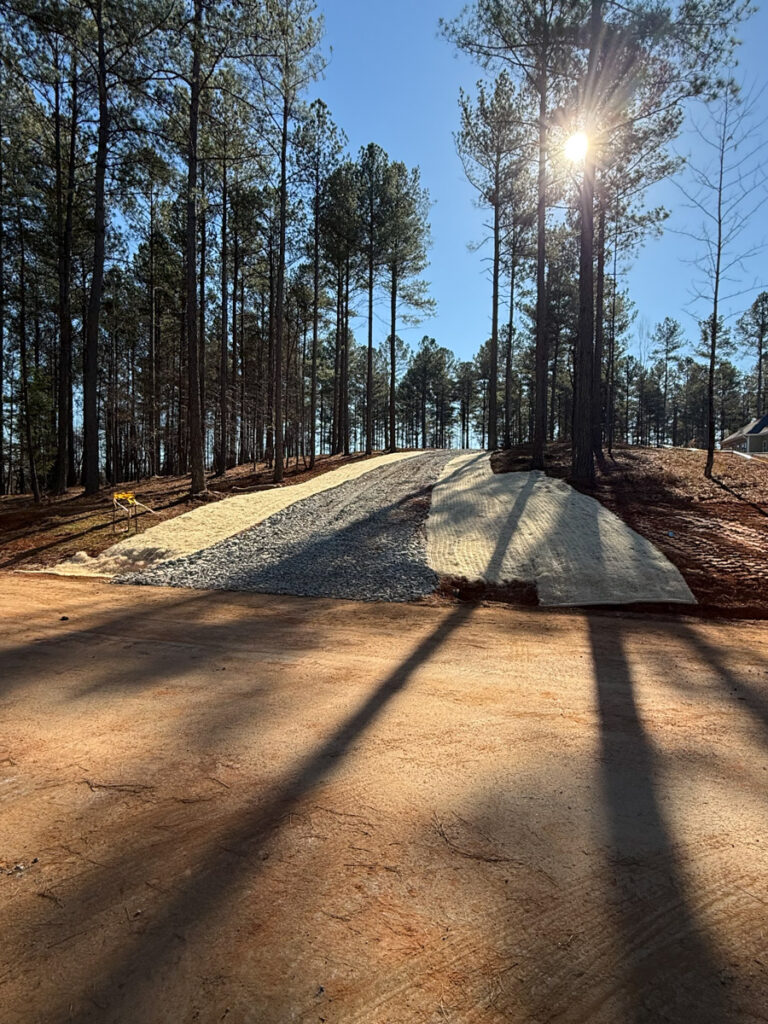 property cleared and gravel driveway installed for new home build