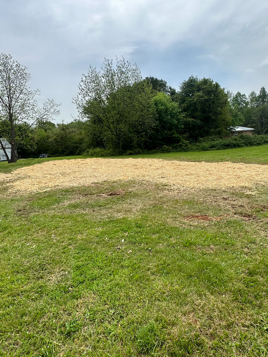 demolition site after being cleared by Francis Brothers team. Mobile home removed and ground covered with straw
