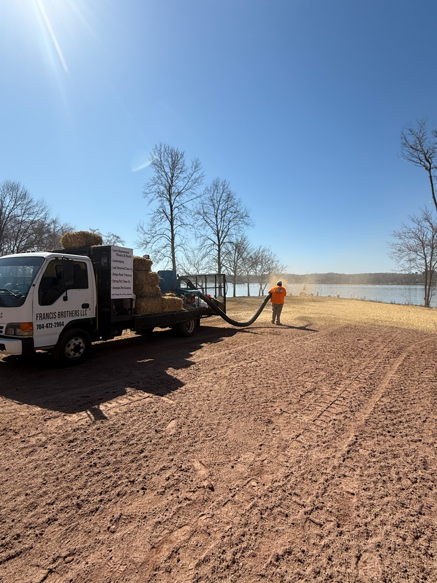 seed and straw being sprayed for erosion control