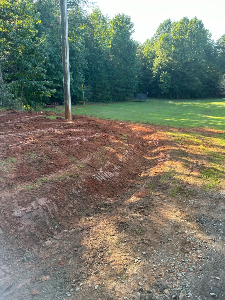 excavation services performed by Francis Brothers, drainage issue addressed by installing a ditch