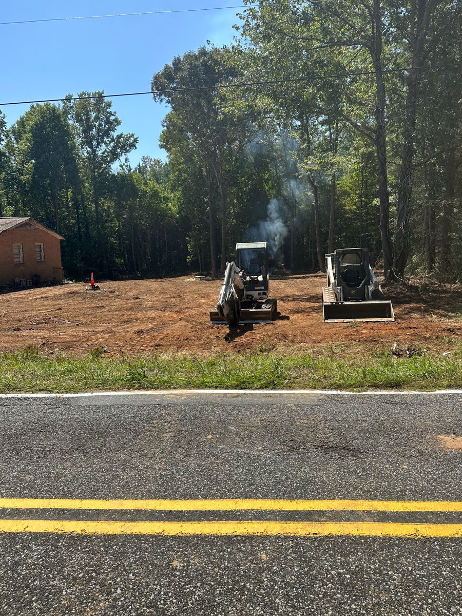 grading and clearing equipment at worksite