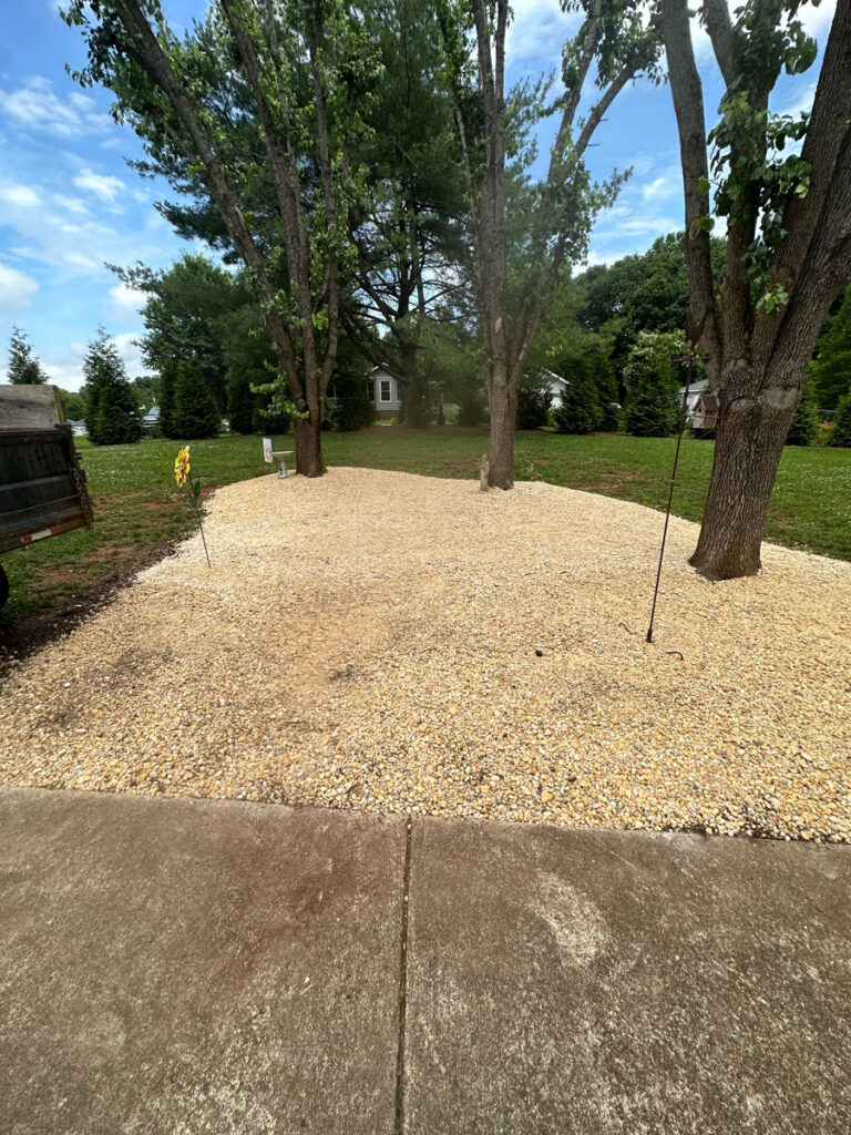 example of property maintenance and landscaping completed by Francis Brothers LLC. White stone laid on property.