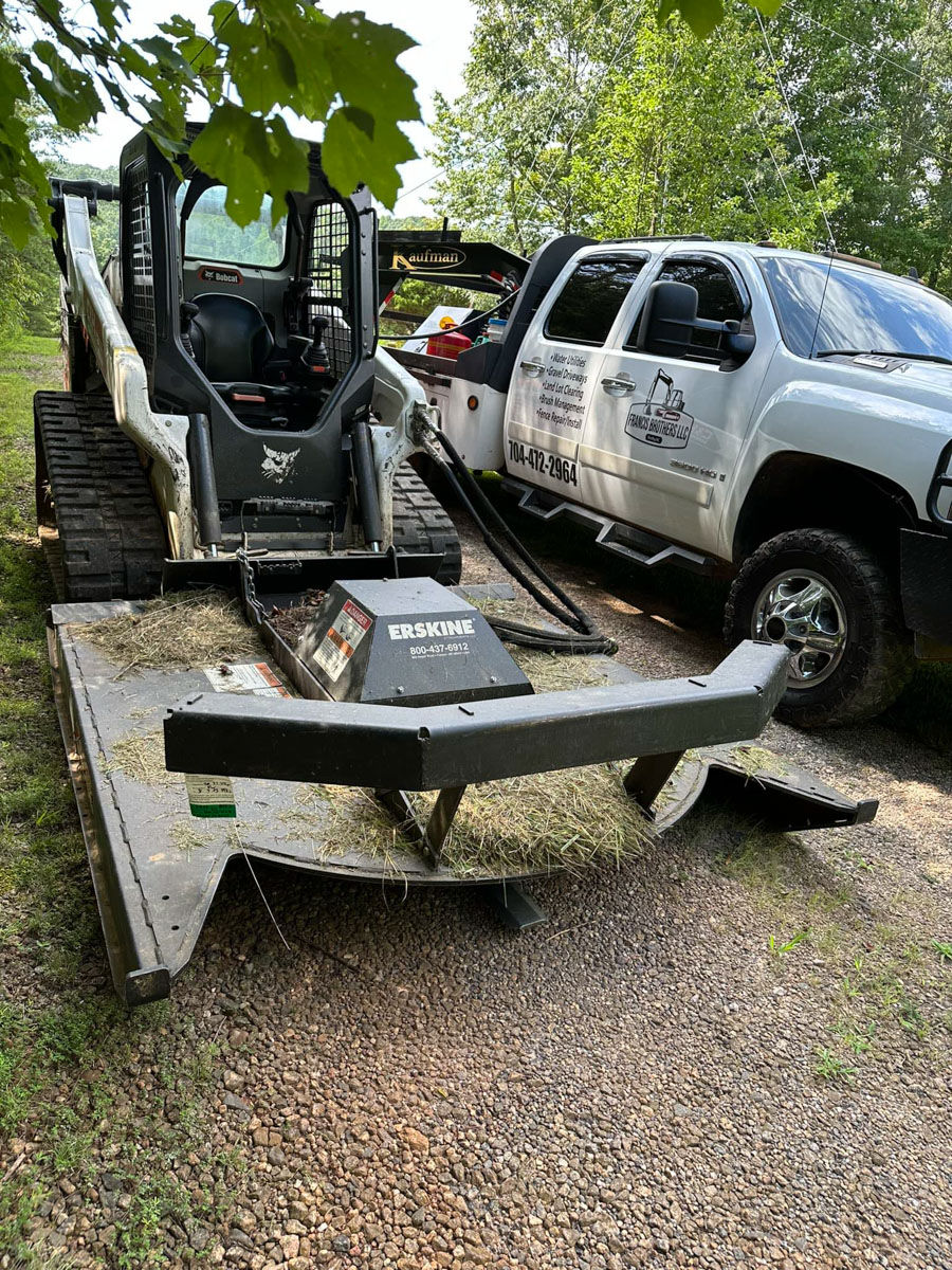 grading and excavating contractor truck and equipment owned by Francis Brothers LLC